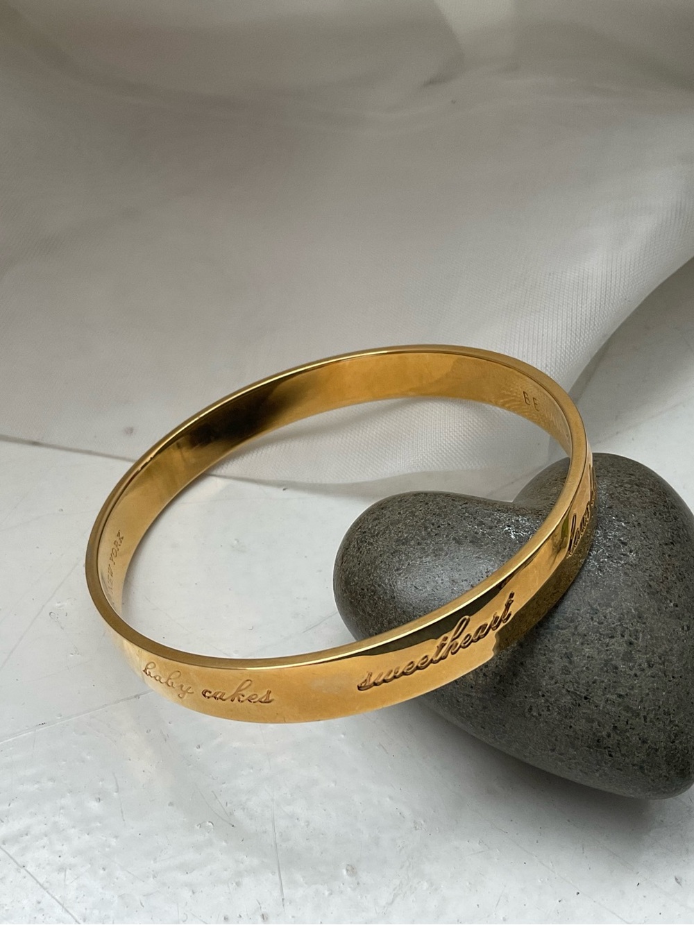 kate spade gold-tone “Be Mine” engraved bangle bracelet